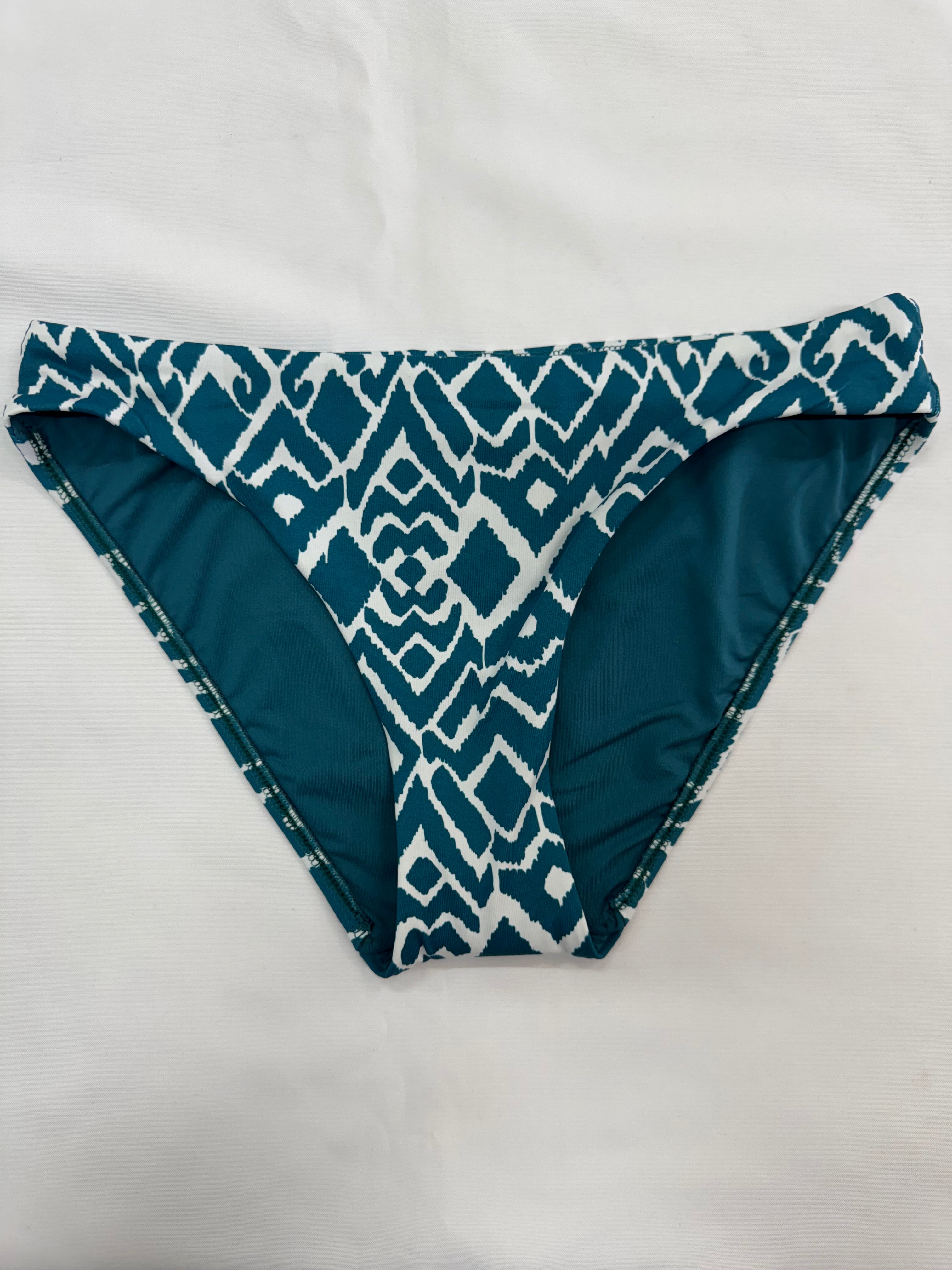 La Selva, is our captivating Ikat print that blends traditional craftsmanship with modern flair. This geometric design features intricate patterns, masterfully woven into shapes that evoke the untamed beauty of the jungle, making La Selva the perfect choice for swimwear that stands out with timeless elegance and a touch of adventurous spirit. Dive into style with La Selva, where tradition meets trend.