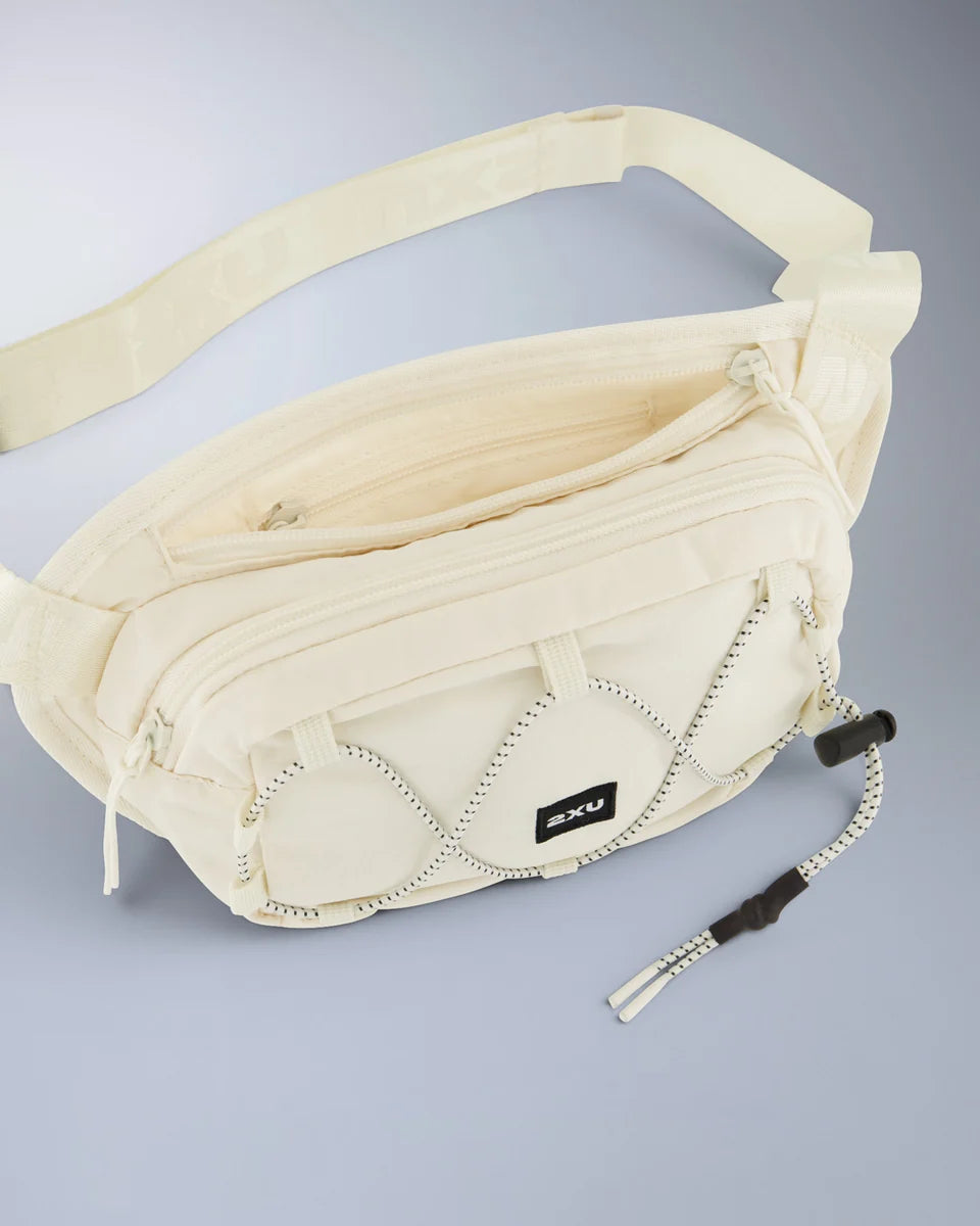 1. Cross body bag
2. Durable ripstop fabric which is abrasion and water resistant
3. Main zip compartment for larger items with mesh pocket and lobster claw keychain
4. Back zip pocket for smaller items you want quick access to
5. Bungee cord to loop garments or gym towel through
6. Padded backing with adjustable strap provides comfortable wear and versatile styling options