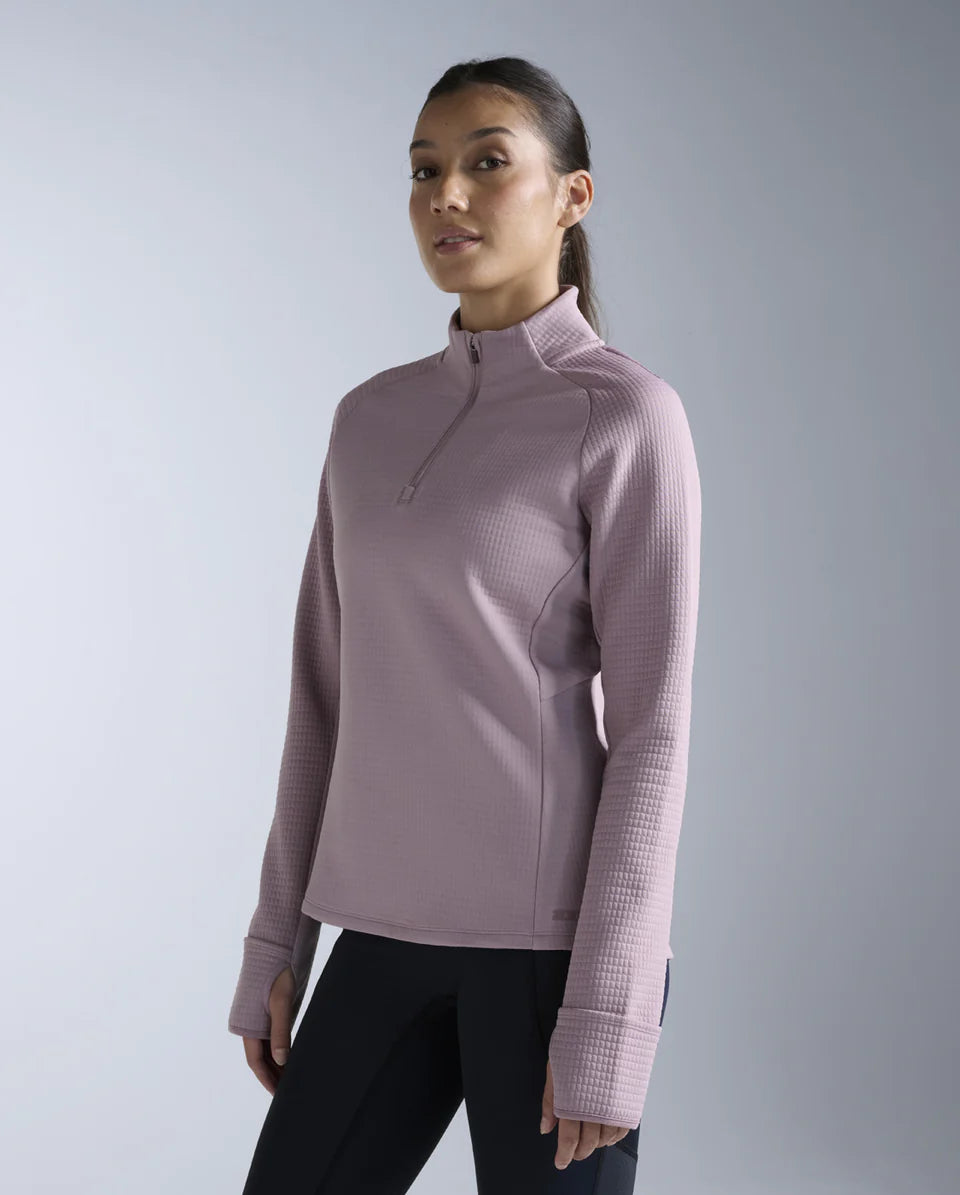 1. 1/4 zip long sleeve
2. Stand collar for neck coverage
3. 315gsm textured puff grid encapsulates air for optimal warmth while reducing microfiber shedding
4. Zip for versatile air flow management
5. Cuffs with thumbholes and flip over mittens to keep cold hands at bay
6. Reflective logos and trims
7. This garment contains recycled yarns