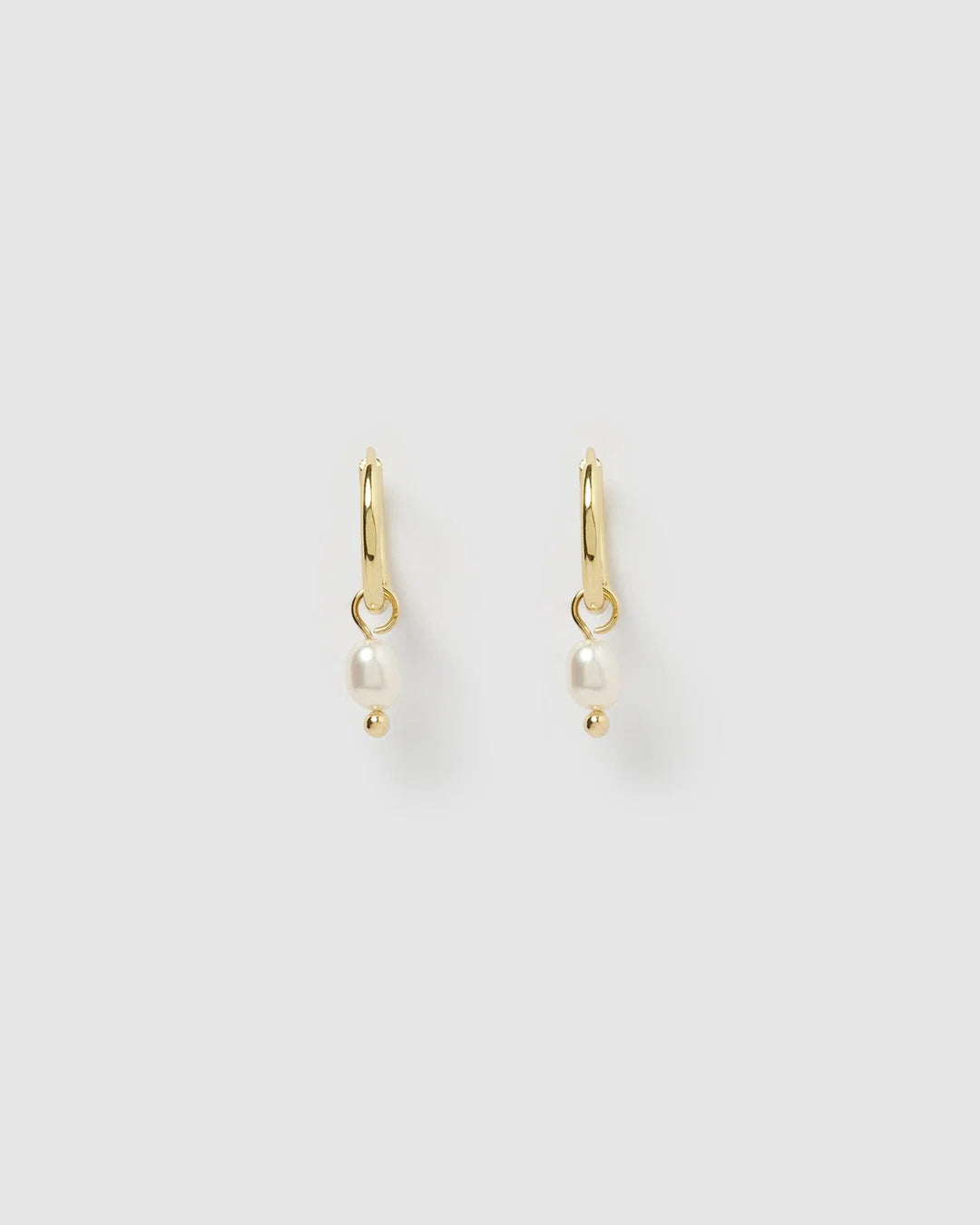 With a delicate pearl drop suspended from a classic gold huggie, Cordelia are easy to stack and style to reflect your unique look.