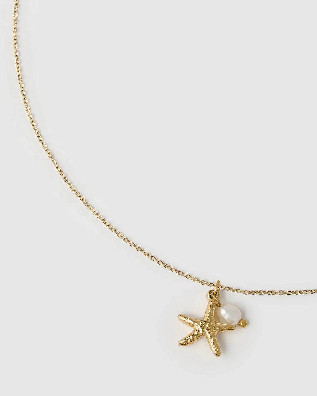 the gorgeous Laguna Necklace, with a cute starfish charm complimented by a stunning freshwater pearl. This pendant is perfect for layering with your favourite staple chain necklaces to create the perfect stack