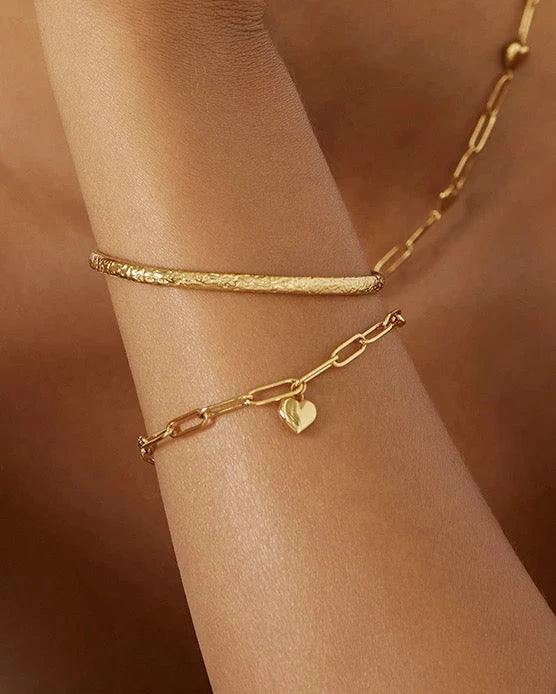 showcasing a stunning crushed gold texture, the Stevie Cuff is designed to turn heads. With its delicate silhouette, classic rounded edges, and slightly malleable fit, this dainty yet striking cuff brings effortless elegance to any jewellery collection.