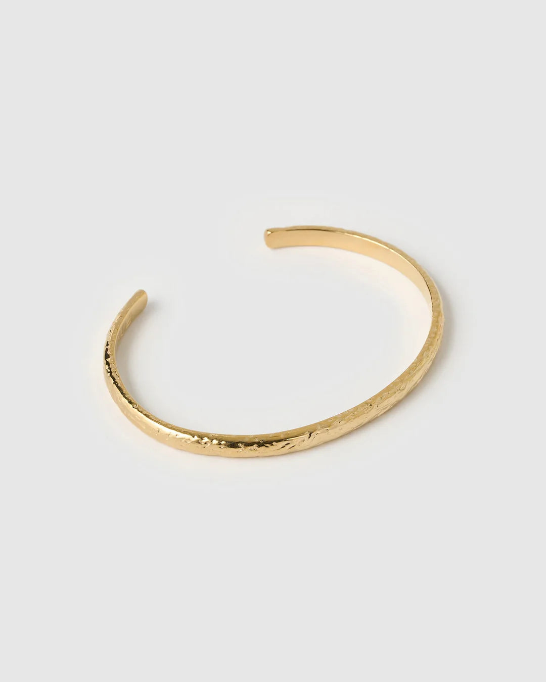 howcasing a stunning crushed gold texture, the Stevie Cuff is designed to turn heads. With its delicate silhouette, classic rounded edges, and slightly malleable fit, this dainty yet striking cuff brings effortless elegance to any jewellery collection.