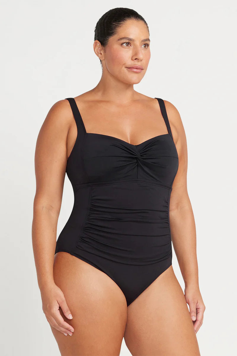 This classic best selling black one piece swimsuit silhouette is designed to fit a multitude of women and has multifit soft foam cups to fit a C - DD cup, a loop front design feature, side panels and front panel ruching for body shaping confidence.