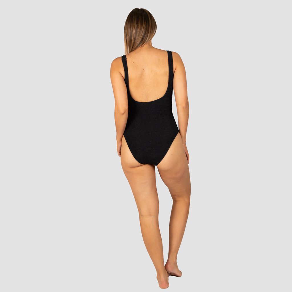 Baku's D/E Cup Underwire One Piece Swimsuit features a flattering hidden underwire, shelf support, flattering low scoop back, fully lined and ring detailing. Baku's exciting new solid Ibiza is crafted from a vibrant and dynamic crinkle fabric with a tactile texture, made in Italy.