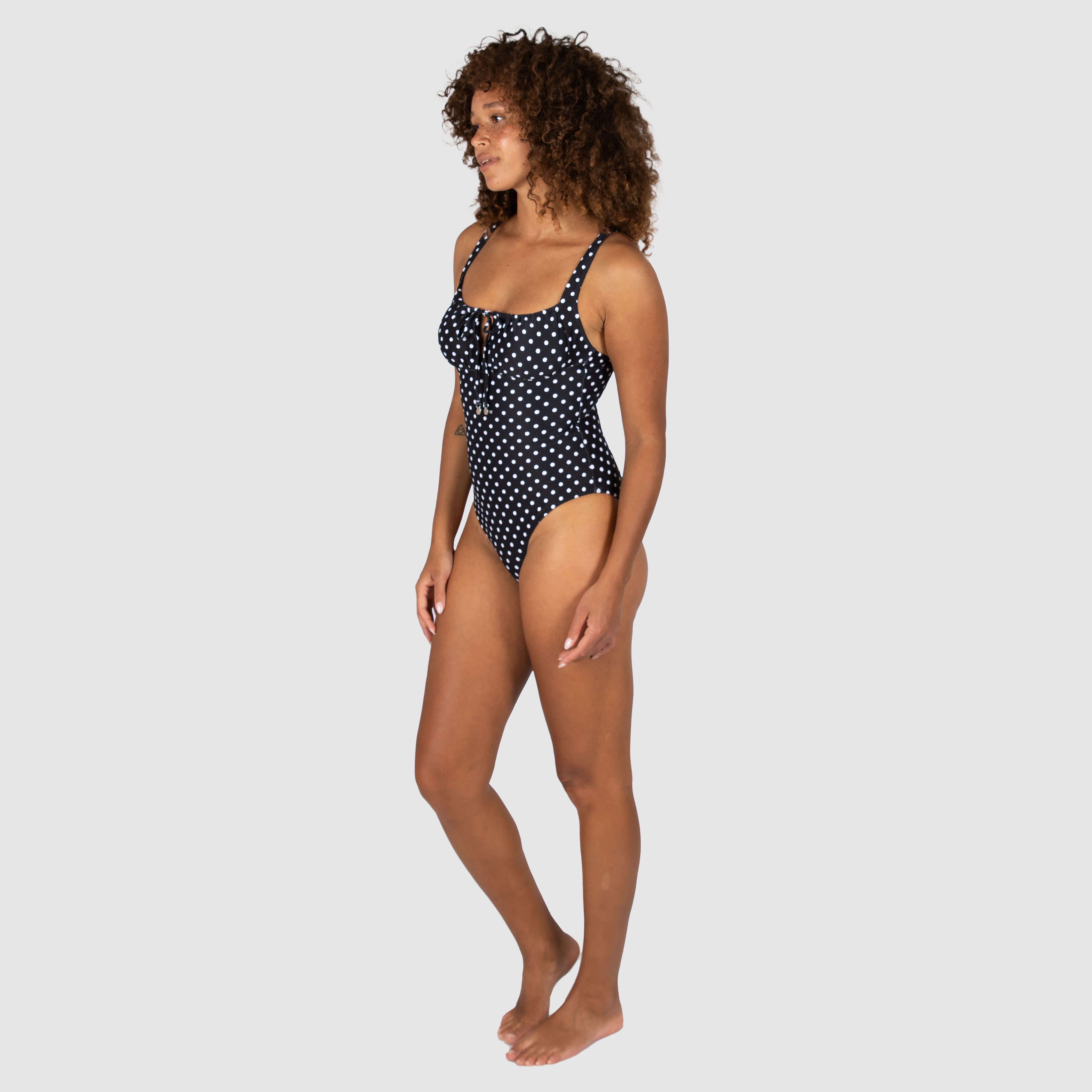 Baku's Parisian Summer Retro One Piece Swimsuit features a flattering ruched bust detail, adjustable straps, and is fully lined.
Embrace timeless elegance with Parisian Summer, a charming vintage polka dot that channels the effortless sophistication of Parisian fashion. Perfect for sun-soaked getaways or leisurely afternoons by the water.