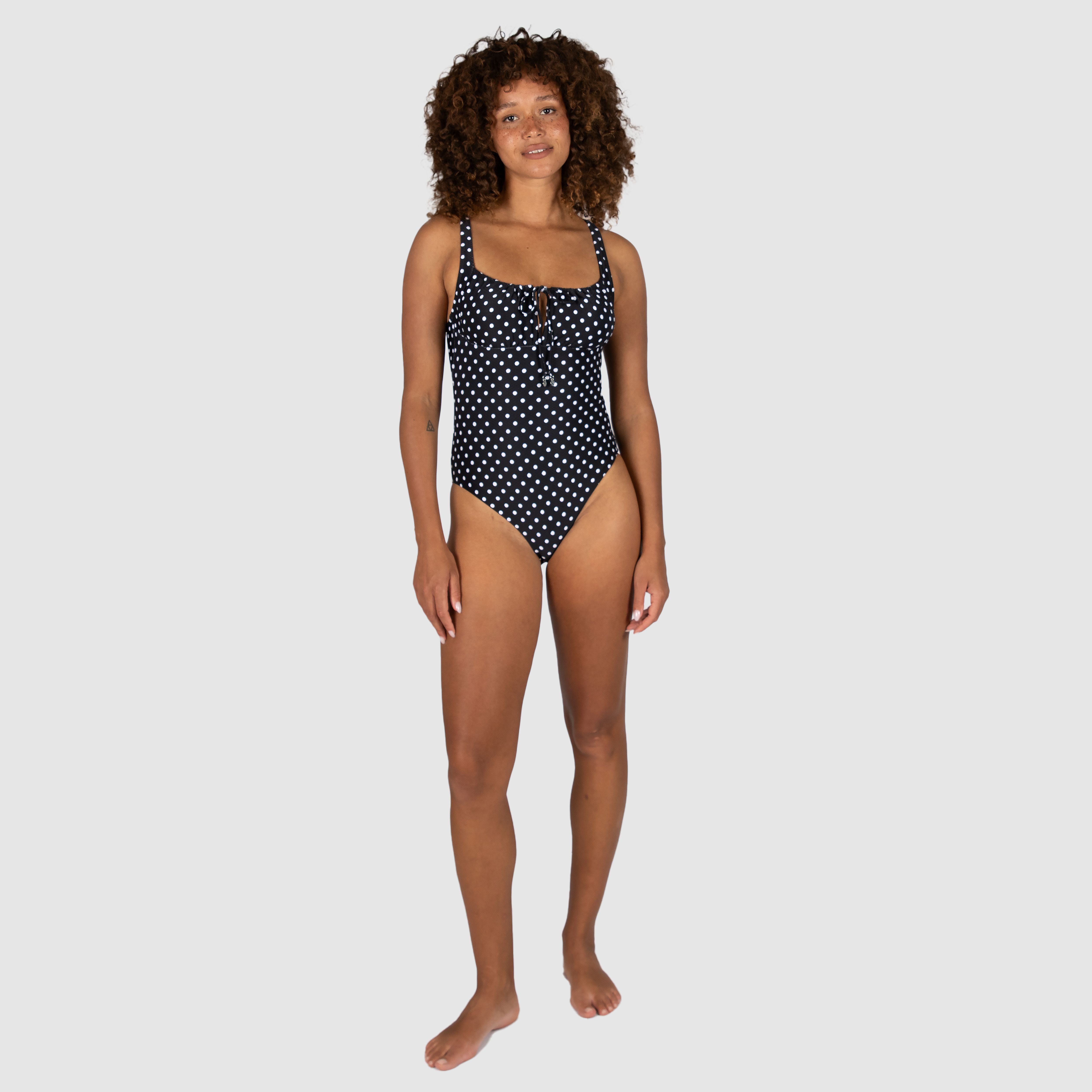 Baku's Parisian Summer Retro One Piece Swimsuit features a flattering ruched bust detail, adjustable straps, and is fully lined.
Embrace timeless elegance with Parisian Summer, a charming vintage polka dot that channels the effortless sophistication of Parisian fashion. Perfect for sun-soaked getaways or leisurely afternoons by the water.