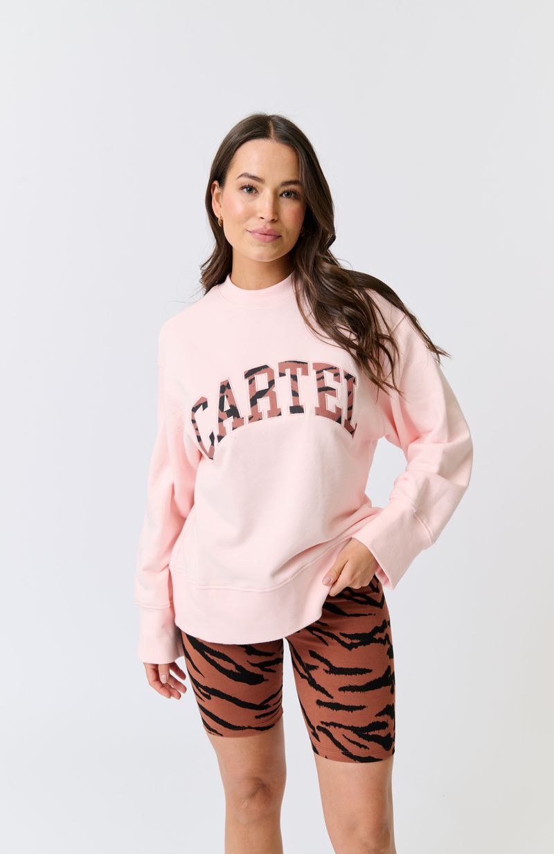 Hip length, relaxed fit sweater
Dropped shoulder gives an effortless look
Ribbed neckline, sleeve cuffs and waistband
Oversized, wide sleeve and cuff
Large Rust Zebra Leppard filled collegiate logo with pink embroidery
100% cotton terry fabric