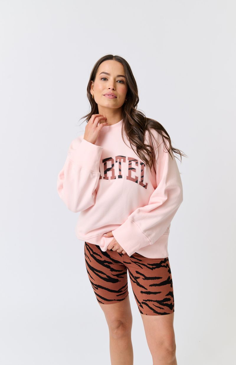 Hip length, relaxed fit sweater
Dropped shoulder gives an effortless look
Ribbed neckline, sleeve cuffs and waistband
Oversized, wide sleeve and cuff
Large Rust Zebra Leppard filled collegiate logo with pink embroidery
100% cotton terry fabric
