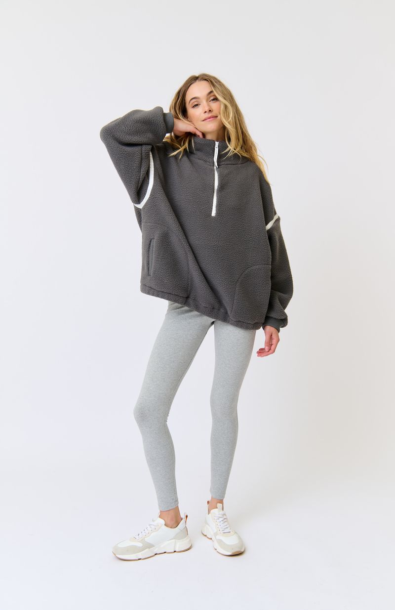 Oversized 1/4 zip pullover
Funnel neck
Ribbed cuffs
Encased elastic through the hem
Drop shoulder with long sleeve
Contrast nylon binding along shoulders and zip
Welt pockets
100% Polyester fleece fabric