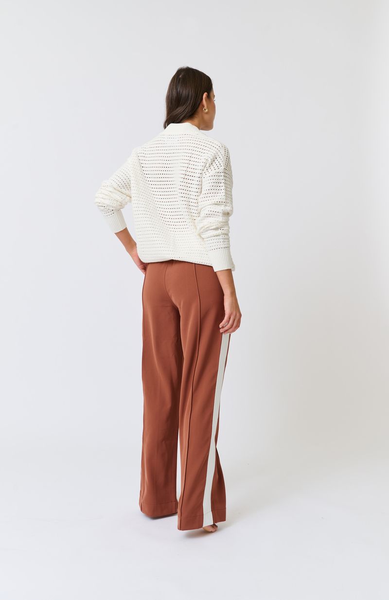 Knit bomber style zip through jacket
Open pointelle knit pattern
Ribbed neck, hemline, sleeve cuffs and zipper placket
Dropped shoulder with long sleeves
Designed to be turned up at the hem for a relaxed look
75% viscose, 25% polyester knit fabric