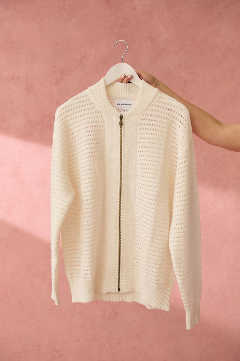 Knit bomber style zip through jacket
Open pointelle knit pattern
Ribbed neck, hemline, sleeve cuffs and zipper placket
Dropped shoulder with long sleeves
Designed to be turned up at the hem for a relaxed look
75% viscose, 25% polyester knit fabric