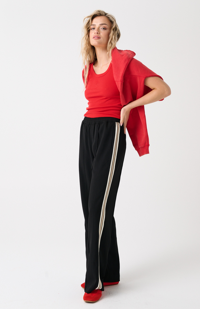 Elasticated waistband
Straight leg fit
Inseam side pockets
Front and back leg pin tuck seam detailing
Lurex stripe tape detailing along outer leg