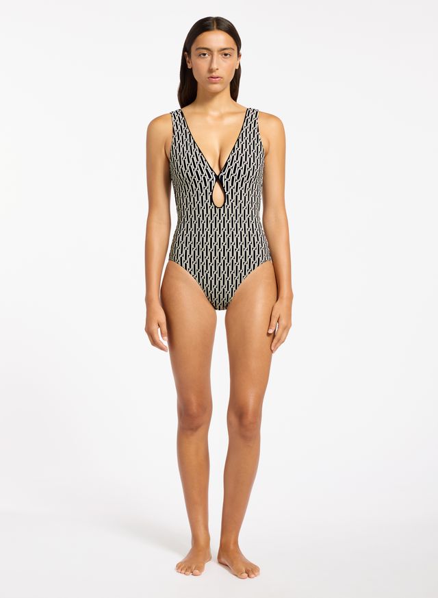 Recycled matte fabric base.
Best suited to an A - C cup.
Removable cups for shape and support.
Internal shelf bra for bust support.
Regular leg, regular back coverage.
Exclusive Jets all over print.
73% Recycled Nylon 27% Elastane