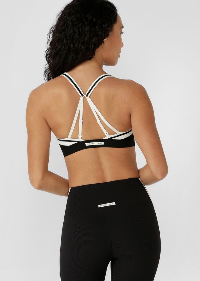 Designed for Active and Swim, with Quick Dry Removable Padding for Shape and Support
Secure Zip Through Design with a Hidden Safety Hook Provides Maximum Support
Convertible Adjustable Shoulder Straps for the Perfect Fit
Hidden Bounce Reducing Lining
LJ Rubber Logo Badge