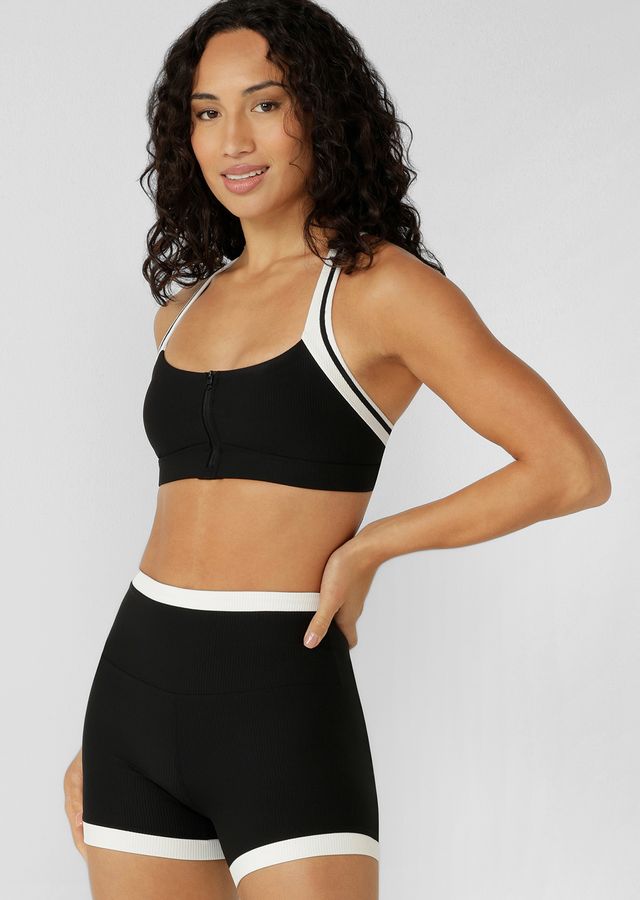 Designed for Active and Swim, with Quick Dry Removable Padding for Shape and Support
Secure Zip Through Design with a Hidden Safety Hook Provides Maximum Support
Convertible Adjustable Shoulder Straps for the Perfect Fit
Hidden Bounce Reducing Lining
LJ Rubber Logo Badge