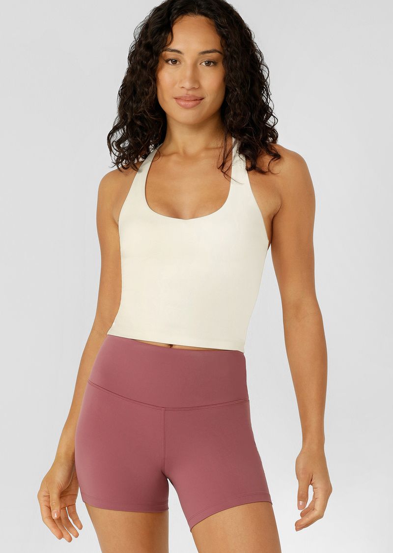 Built in Shelf Bra with Removable Padding for All Day Support
Form Flattering Cropped Fitted Silhouette
Supportive Racerback Silhouette Clears the Shoulder Blades