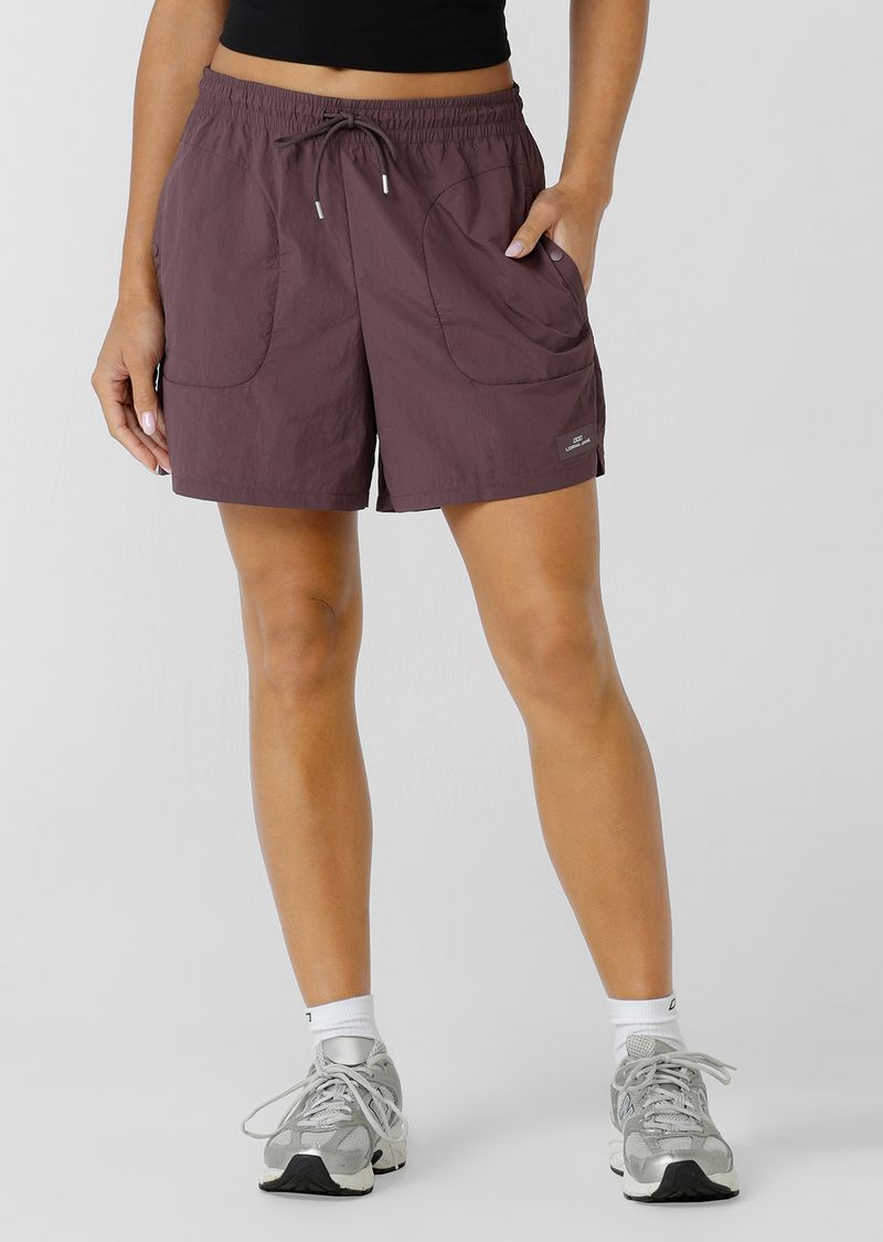 Mid Rise Longer Line Silhouette, 12.5cm Inseam
Water Repellent Taslon Active Fabrication
Notched Side Seams for Unrestricted Movement
Elasticated Waistband with Drawcord Adjustability
3 Pocket Design to Stash your Essentials- 2x Press Stud Side Pockets with Second Zip Pocket Layer