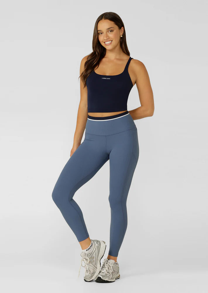 Internal Bra with Removable Padding for All Day Support
Intricate Strappy Back Design
Moisture Wicking Bare Minimum Fabrication for that Barely There Feeling
Form Flattering Slightly Cropped Silhouette
LJ Rubber Logo Badge