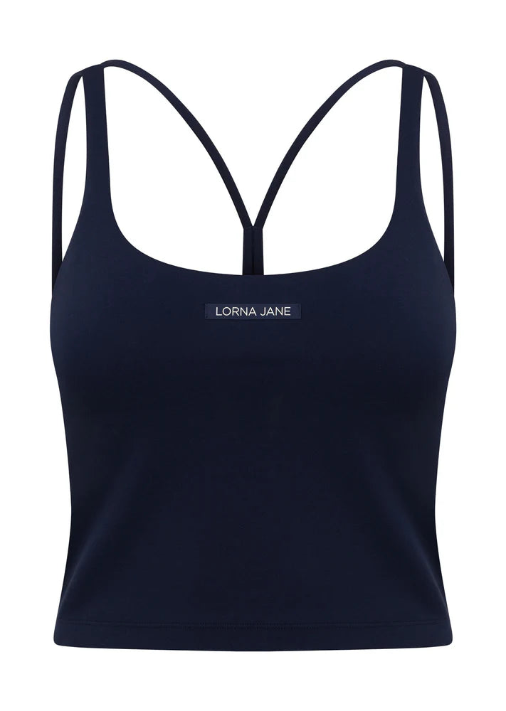 Internal Bra with Removable Padding for All Day Support
Intricate Strappy Back Design
Moisture Wicking Bare Minimum Fabrication for that Barely There Feeling
Form Flattering Slightly Cropped Silhouette
LJ Rubber Logo Badge