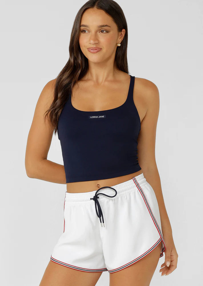 Internal Bra with Removable Padding for All Day Support
Intricate Strappy Back Design
Moisture Wicking Bare Minimum Fabrication for that Barely There Feeling
Form Flattering Slightly Cropped Silhouette
LJ Rubber Logo Badge