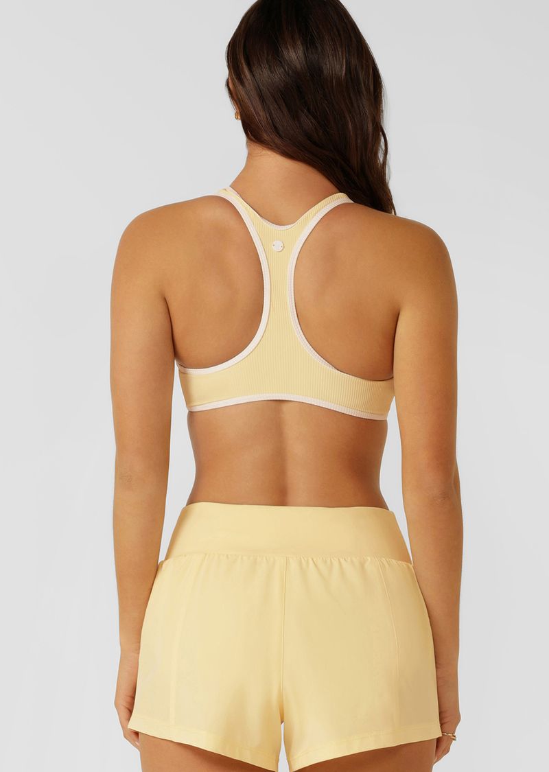 Supportive Racerback Silhouette for All Day Comfort & Support
Designed for Active and Swim, with Quick Dry Padding
Form Flatting V Shaped Neckline with Curved Underbust Band
Sweat Wicking Active Rib Fabrication
Contrast Binding for a Retro-Sport inspired look