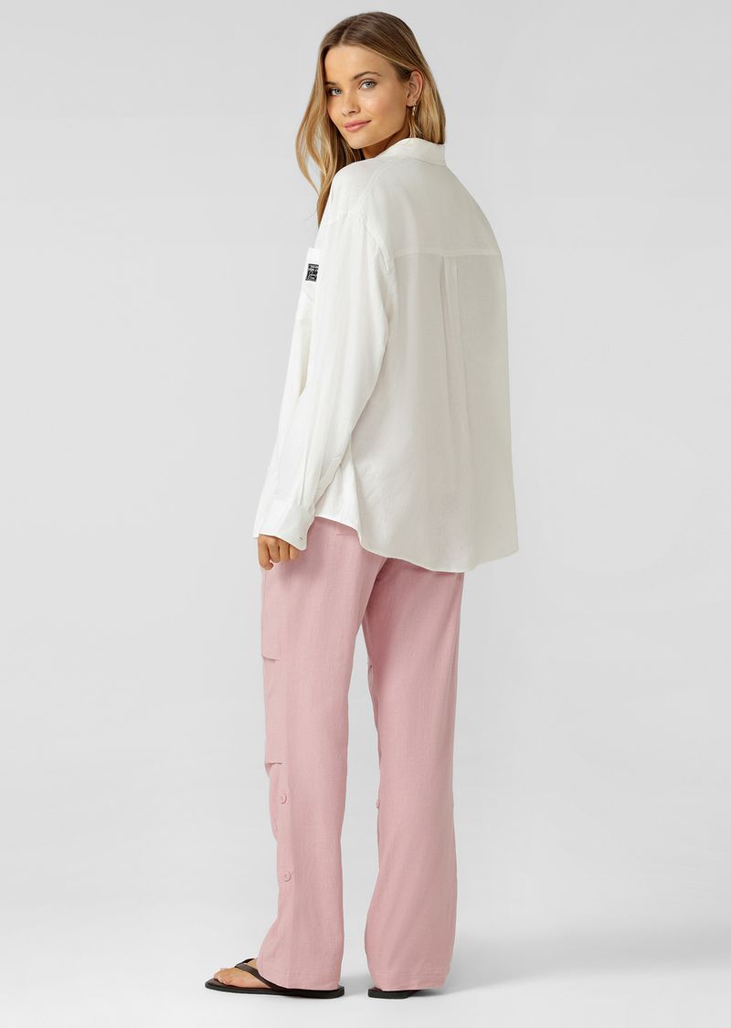 Effortless Relaxed Fit Silhouette with Curved Hem
Button Through Opening and Sleeve Cuffs (+ a Spare)
chest pocket to stash your essentials
Limited Edition Logo Patch