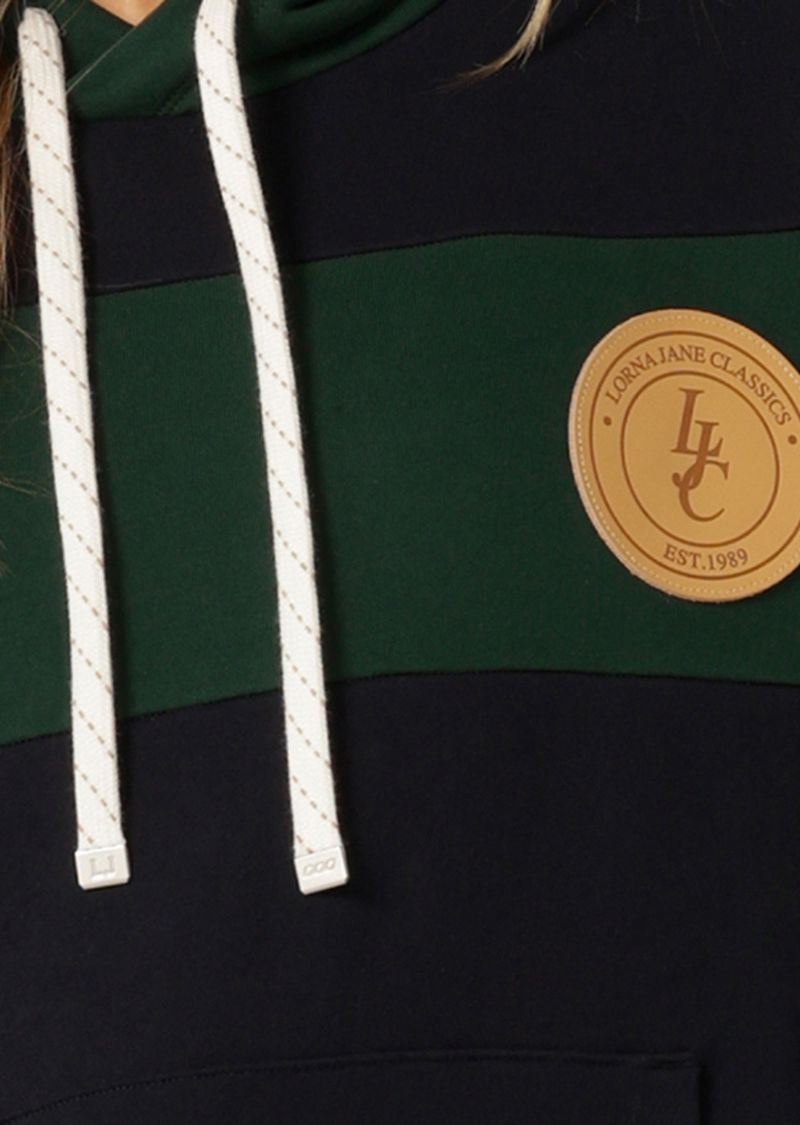 Hooded Design with Drawcord Adjustability
Elevated Rugby Stripe Panel Design
Oversized Vintage Sweatshirt Inspired Fit
Front Kangaroo Pocket to Stash your Essentials
Premium Patch Logo