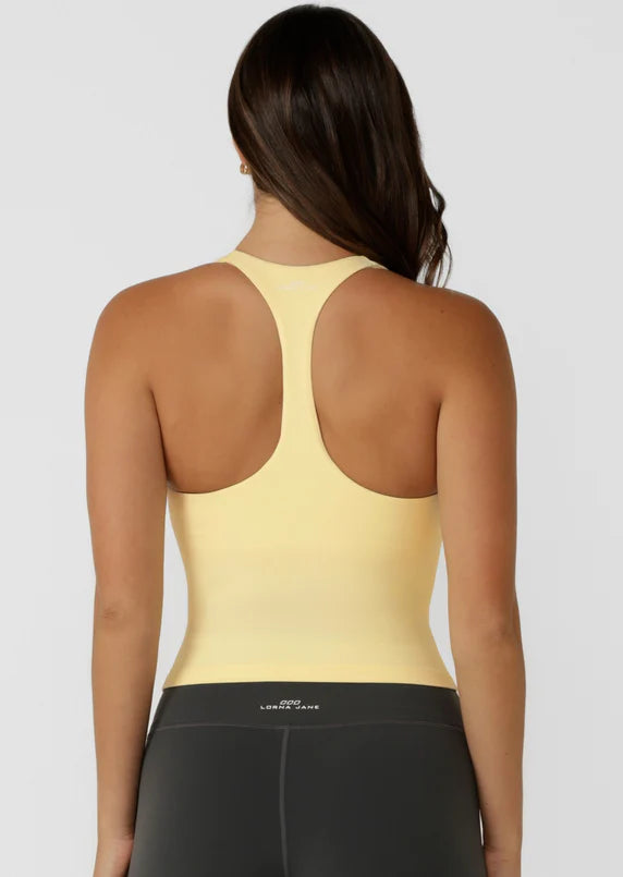 Built in Shelf Bra with Removable Padding for All Day Support
Form Flattering Cropped Fitted Silhouette
Supportive Racerback Silhouette Clears the Shoulder Blades