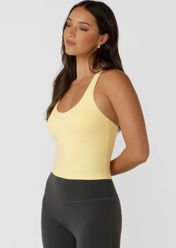 Built in Shelf Bra with Removable Padding for All Day Support
Form Flattering Cropped Fitted Silhouette
Supportive Racerback Silhouette Clears the Shoulder Blades