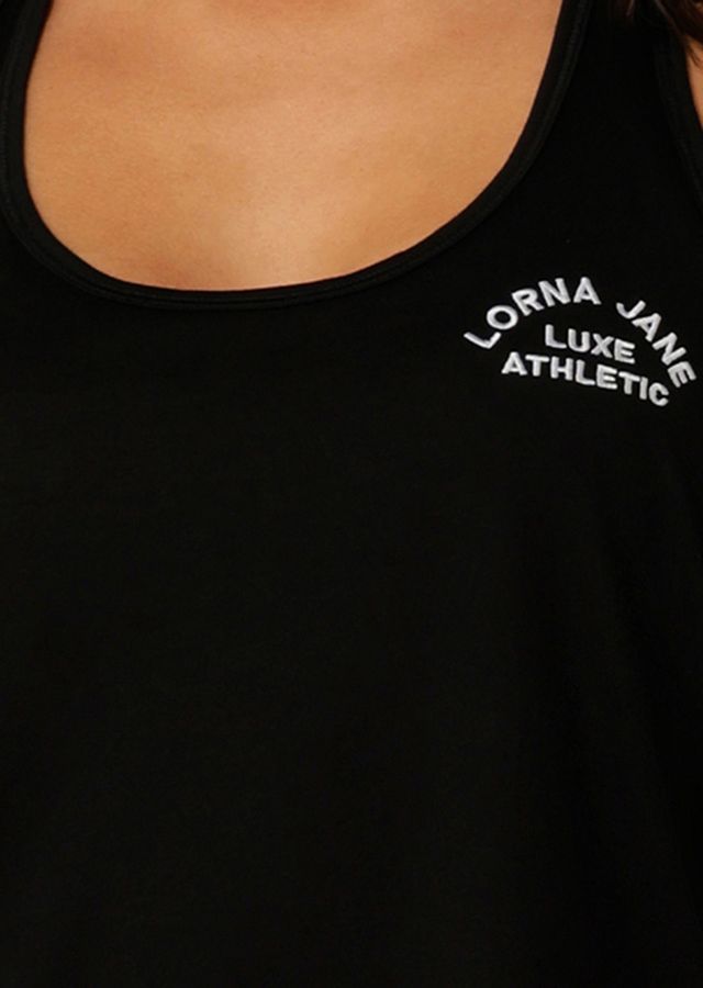 Lightweight Layering Wardrobe Essential
Relaxed Long Line Silhouette
Racerback design for easy laying over most bras
Heritage Embroidered Logo