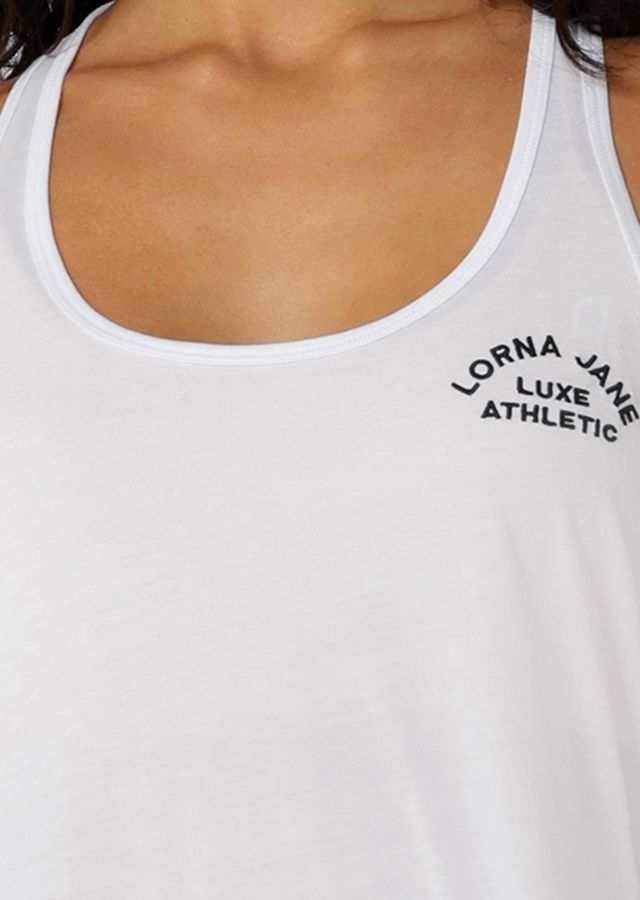 Lightweight Layering Wardrobe Essential
Relaxed Long Line Silhouette
Racerback design for easy laying over most bras
Heritage Embroidered Logo