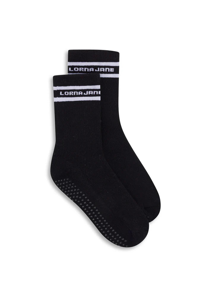 Iconic Non-Slip Grip Logo at Soles
Quarter Crew Length
Breathable Cotton Blend Fabric