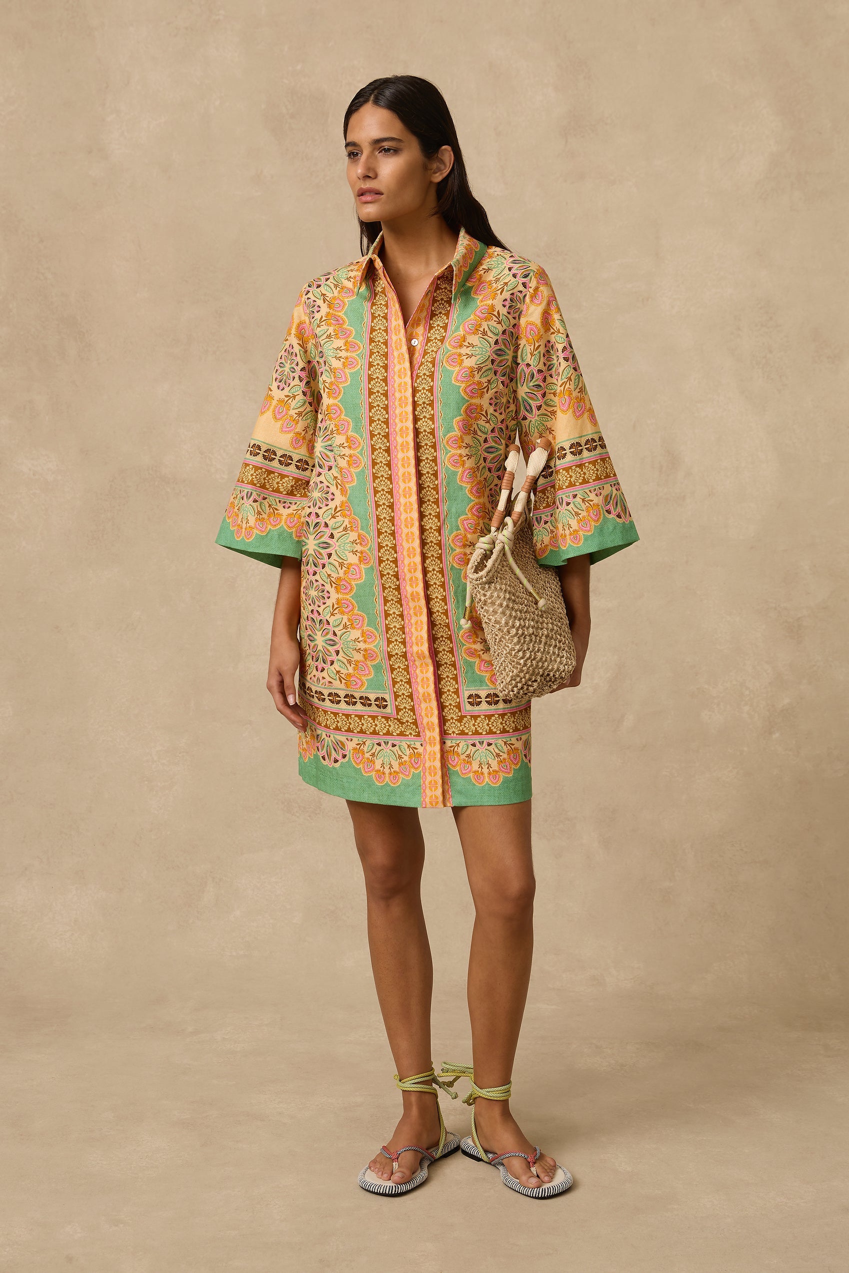 The Selma Shirt Dress is a linen mini shirt dress with a concealed front placket opening, classic collar, 3/4 length loose sleeves, placement print throughout and removable rope tie belt.