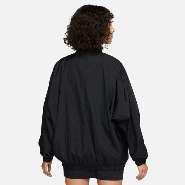 Stay covered without losing a stitch of style in this oversized, carefree jacket. An oversized fit and a mesh lining make it perfect for layering, while elastic at the waist and cuffs help keep it in place as you move through your day.  Internal bungee and drawcord at hem help you personalize your fit. Double welt hand pockets provide quick small-item storage.