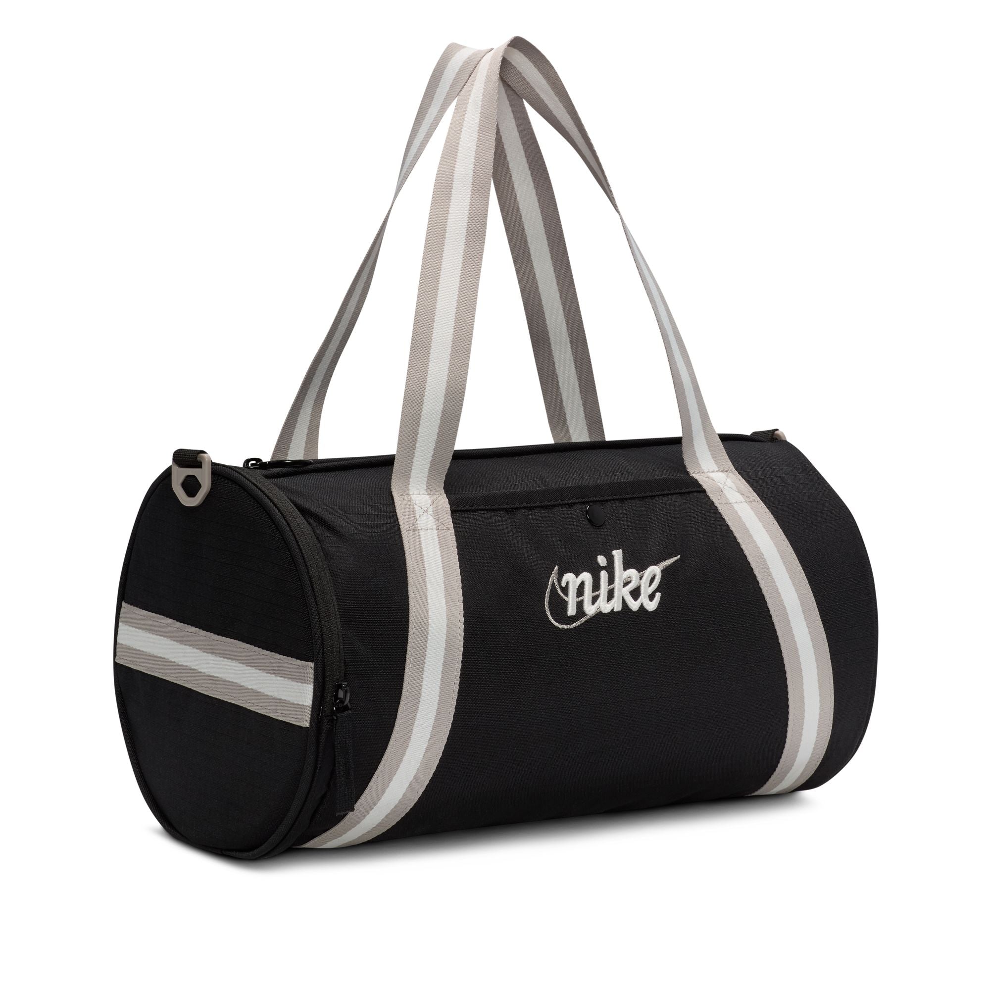 Throw it back in style at the gym or hanging out with friends with this retro-themed duffel bag. It features a large compartment for storing your daily stuff as well as a smaller front pocket for all your easy-to-grab necessities. This bag also has optional grab-and-go handles, or you can use the adjustable clip-on shoulder strap.