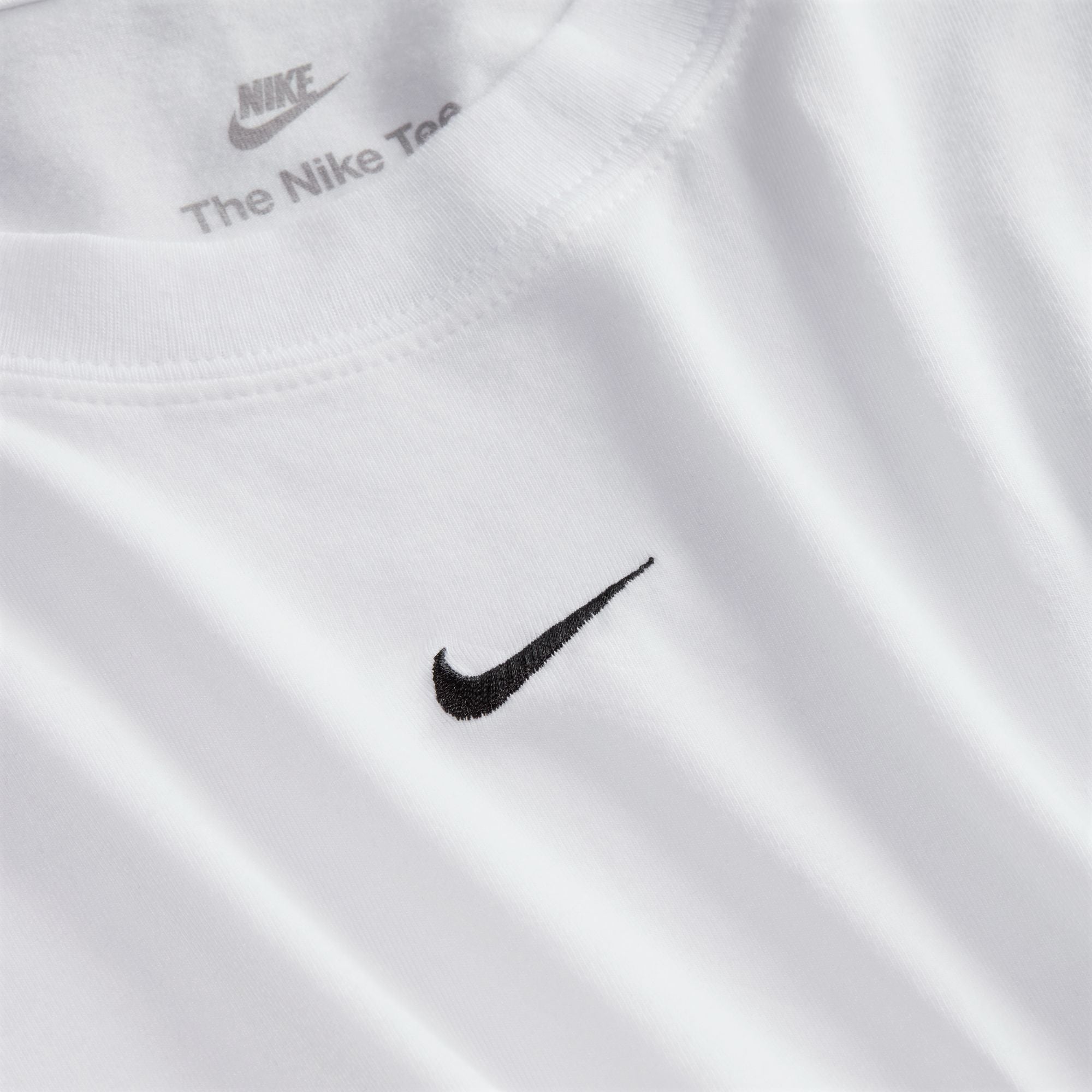 Perfect for any day, this slightly cropped, slim-fitting tee is classic and versatile. Nike's smooth jersey feels stretchy with a slight drape, giving it a comfortable, body-skimming feel.