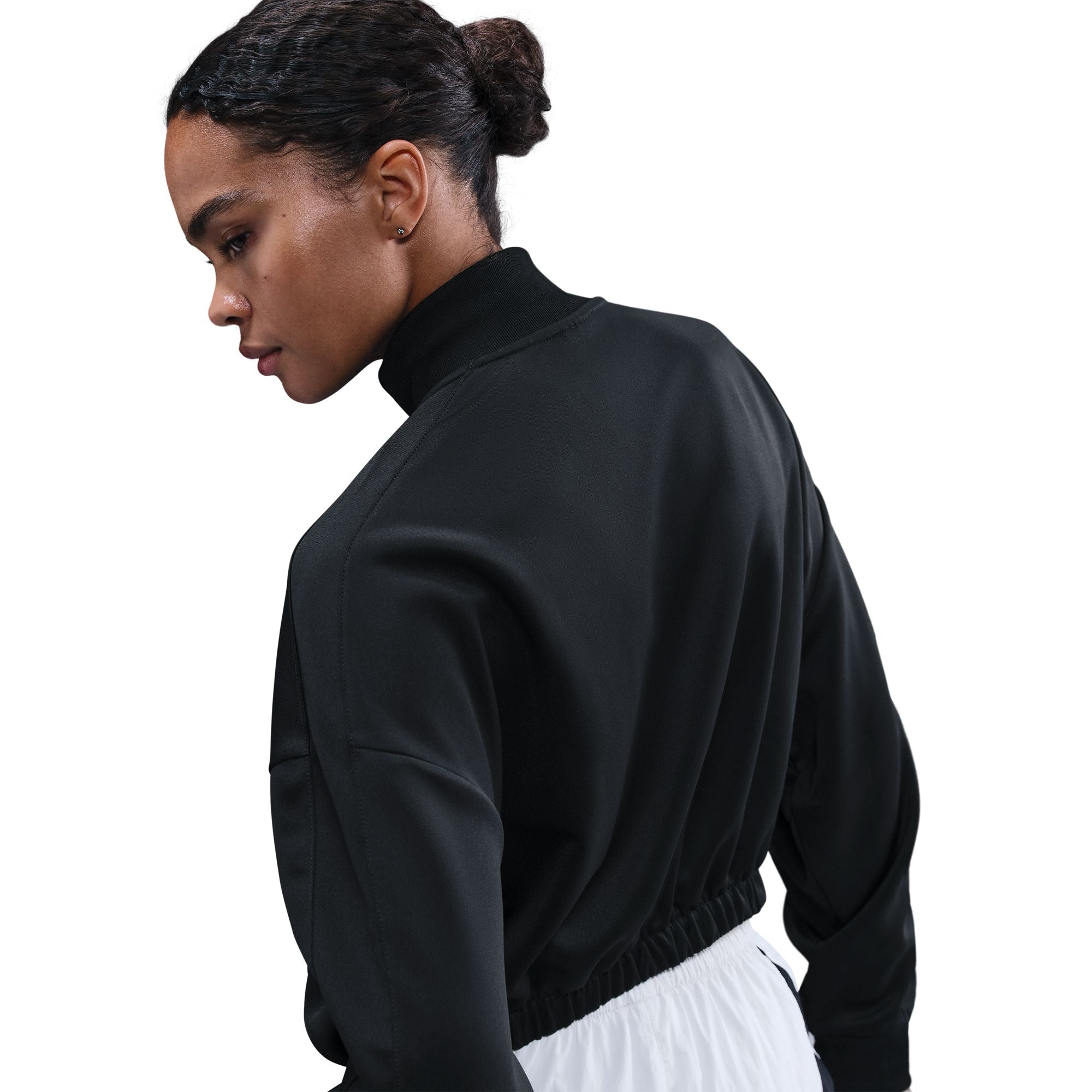 This classic track jacket is elevated through volume and drape. Elastic at your waist cinches in the oversized and slightly cropped silhouette.