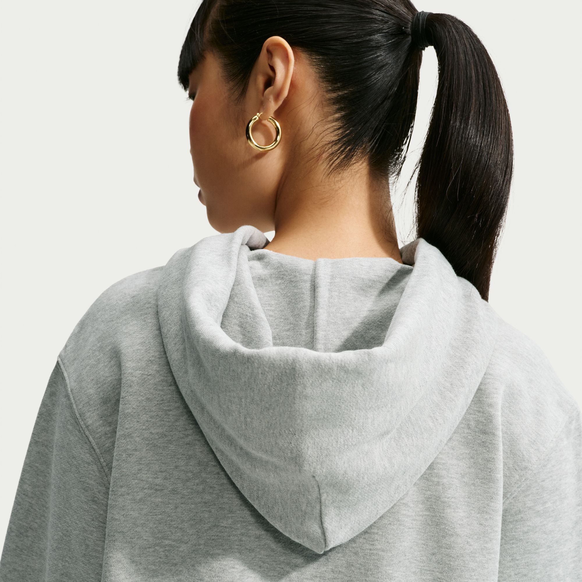 Person wearing a grey Nike hoodie