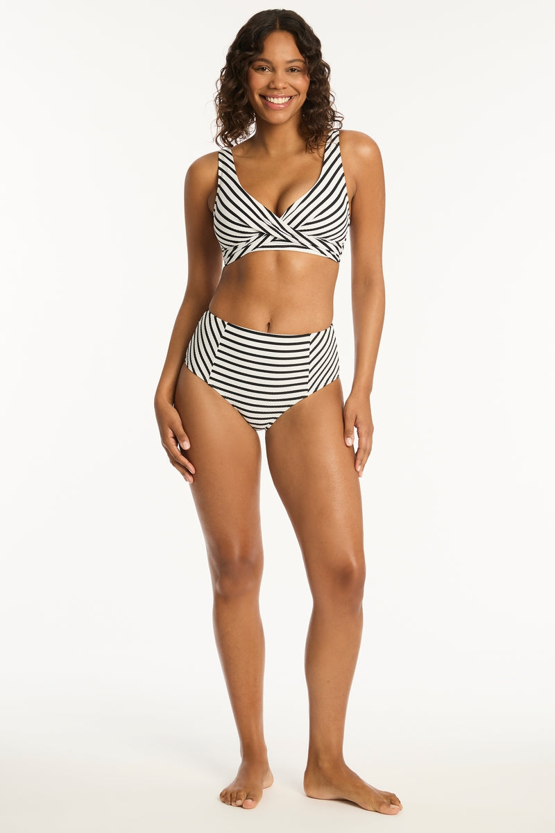 <ul> <li>High waisted</li> <li>Moderate bottom coverage</li> <li>Powermesh lining for front & back support</li> </ul>