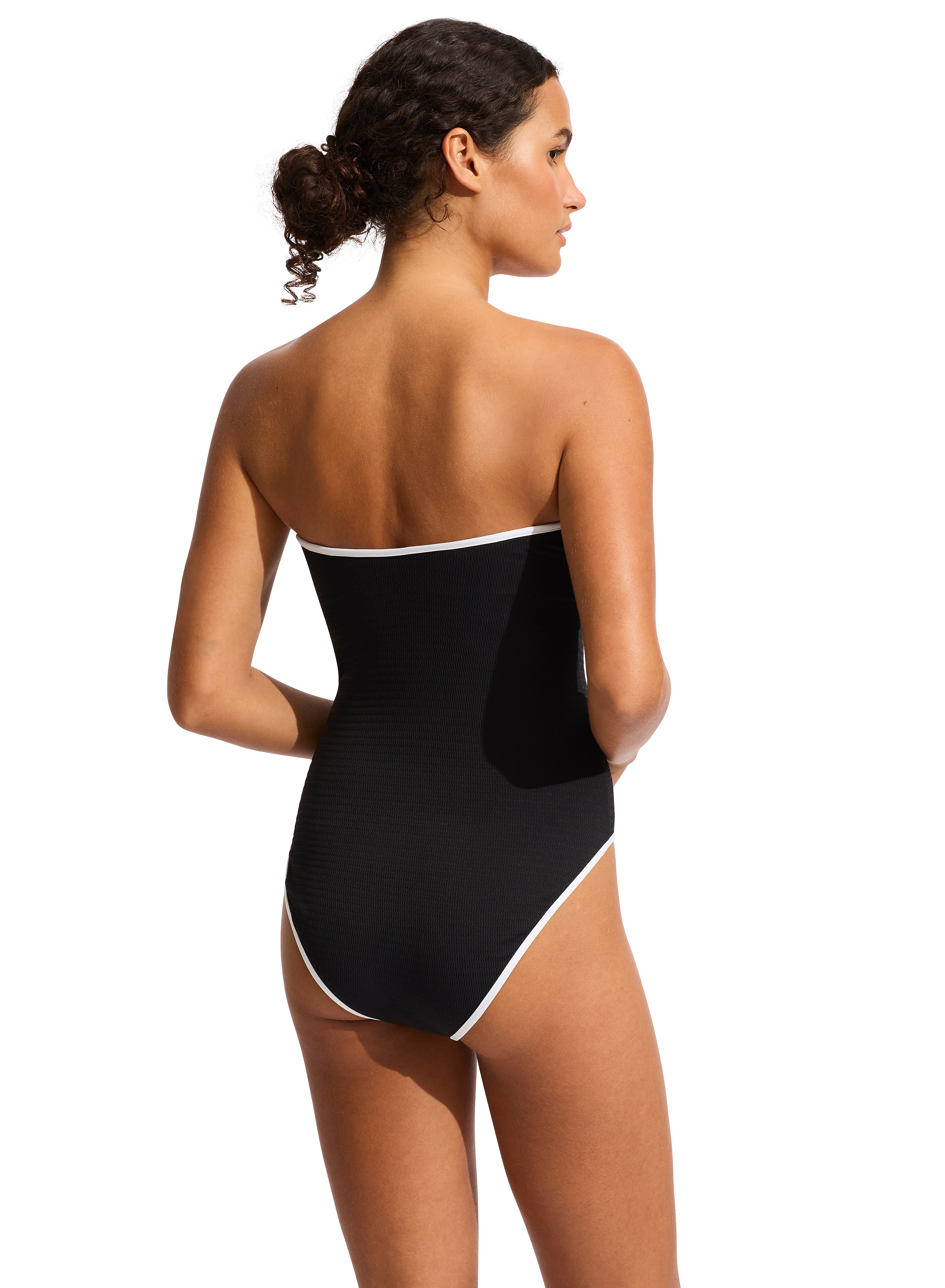 The DD Bandeau One Piece features an internal shelf bra, hidden underwire, gripper tape, removable & adjustable straps, high legline, contrast bin