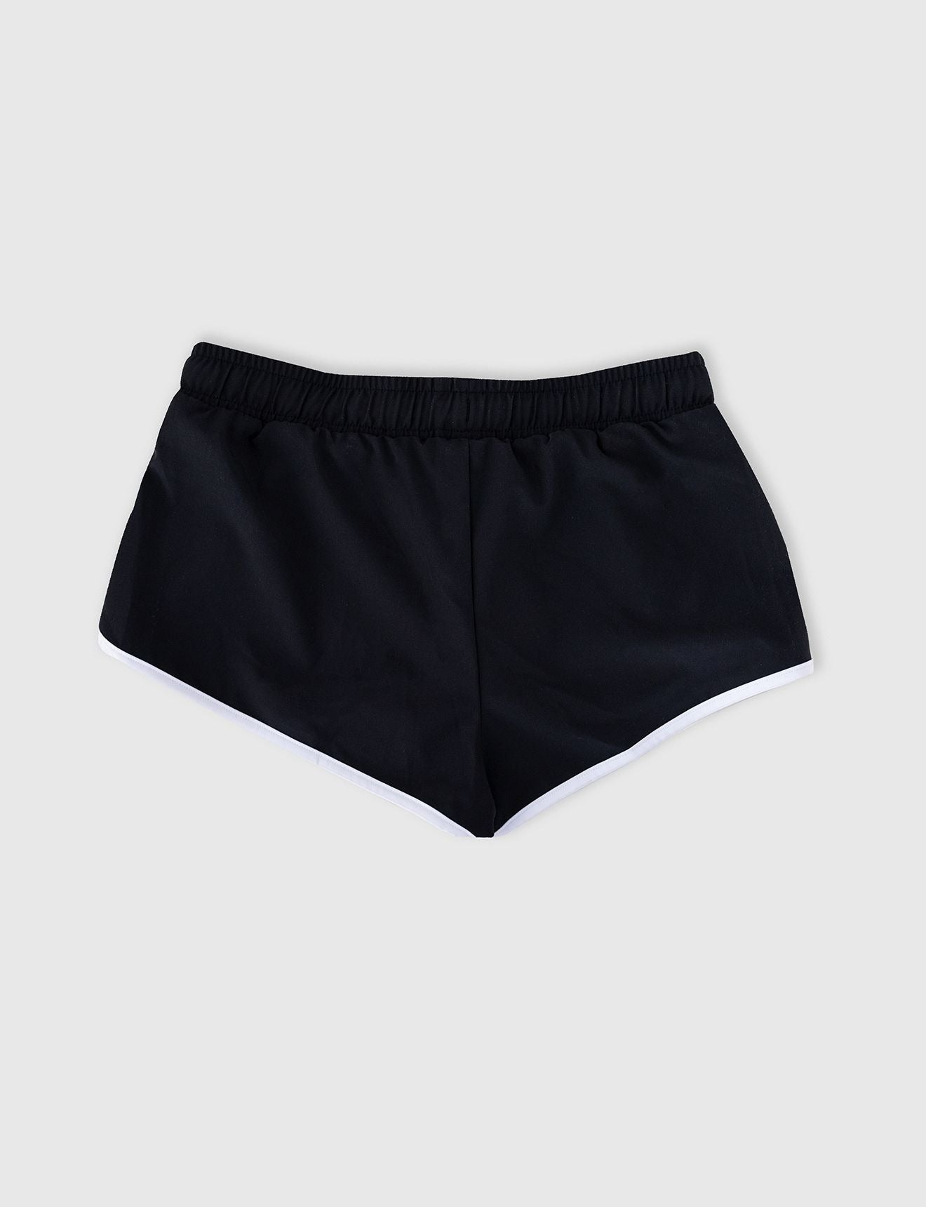 Seafolly Girls Essentials Boardshort in Black features an elasticated waistband, draw cord, scallop hemline, contrast piping.