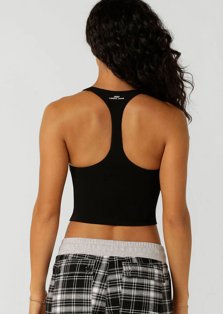 Built in Shelf Bra with Removable Padding for All Day Support
Form Flattering Cropped Fitted Silhouette
Supportive Racerback Silhouette Clears the Shoulder Blades
