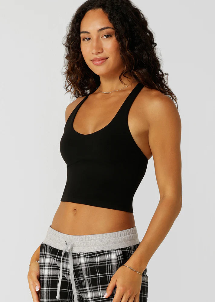 Built in Shelf Bra with Removable Padding for All Day Support
Form Flattering Cropped Fitted Silhouette
Supportive Racerback Silhouette Clears the Shoulder Blades