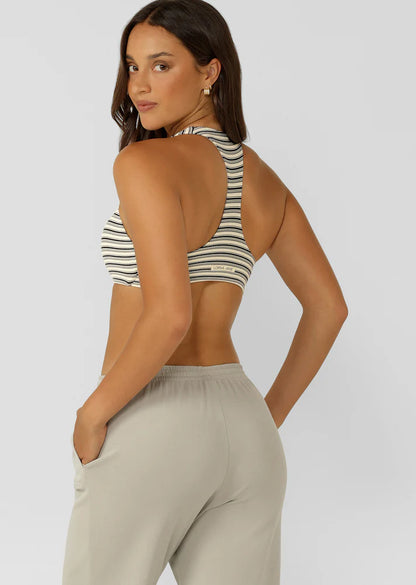 Racerback Silhouette that Clears the Shoulder Blades provides All Day Support
Premium Luxe Active Rib in a Fashion Forward Striped Design
Removable Padding for Added Shape and Support
LJ Rubber Logo Badge