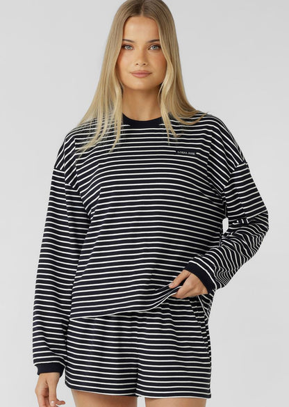 Versatile Lounge Essential
Classic Ribbed Crew Neckline and Cuffs
Form Flattering Mid Length Relaxed Silhouette
Premium Cotton Fabrication In a Classic Stripe Design
Woven Logo Badge