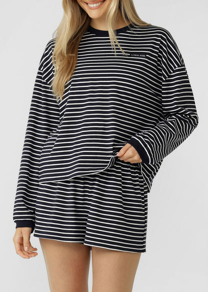 Versatile Lounge Essential
Classic Ribbed Crew Neckline and Cuffs
Form Flattering Mid Length Relaxed Silhouette
Premium Cotton Fabrication In a Classic Stripe Design
Woven Logo Badge