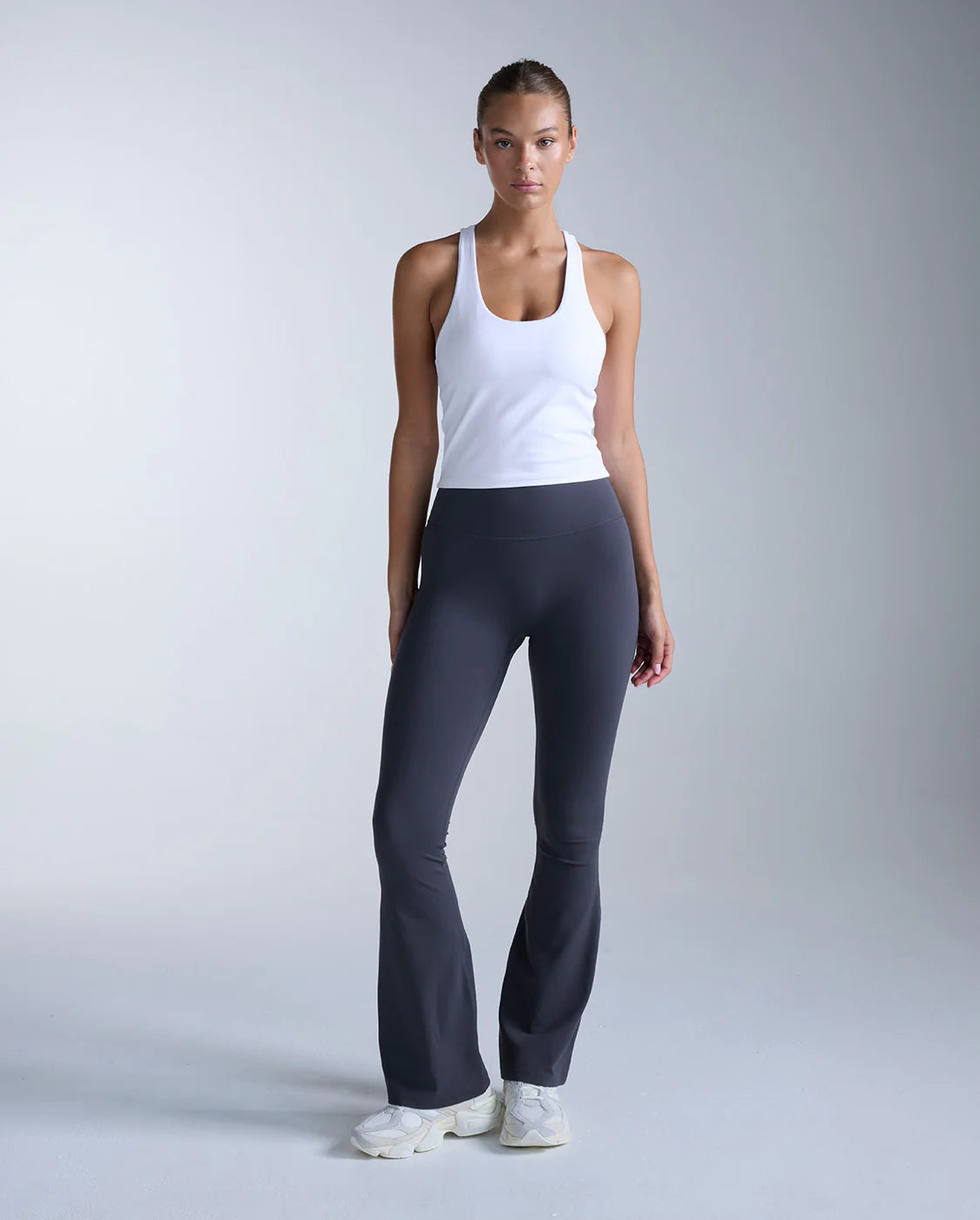 Buttery smooth from hip to hem, the Fluid Hi-Rise Flare Pants contour where you want hold and soften where you want flow, sculpting your shape through the waist and knee before easing into a smooth, natural flare.