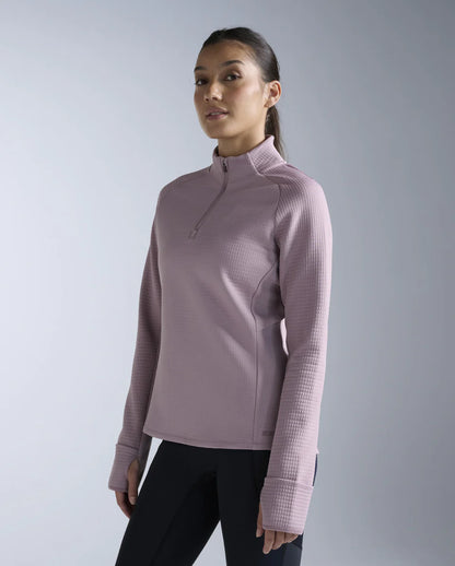 1. 1/4 zip long sleeve
2. Stand collar for neck coverage
3. 315gsm textured puff grid encapsulates air for optimal warmth while reducing microfiber shedding
4. Zip for versatile air flow management
5. Cuffs with thumbholes and flip over mittens to keep cold hands at bay
6. Reflective logos and trims
7. This garment contains recycled yarns