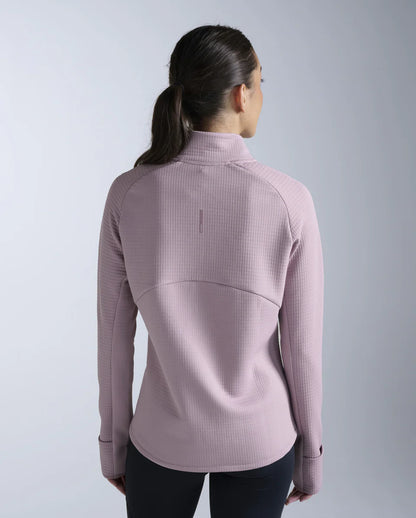 1. 1/4 zip long sleeve
2. Stand collar for neck coverage
3. 315gsm textured puff grid encapsulates air for optimal warmth while reducing microfiber shedding
4. Zip for versatile air flow management
5. Cuffs with thumbholes and flip over mittens to keep cold hands at bay
6. Reflective logos and trims
7. This garment contains recycled yarns